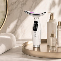 LUMÉA GLOW 7 styled on a champagne vanity tray with skincare bottles